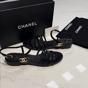 CHANEL Strappy Black Sandals with Gold Logo